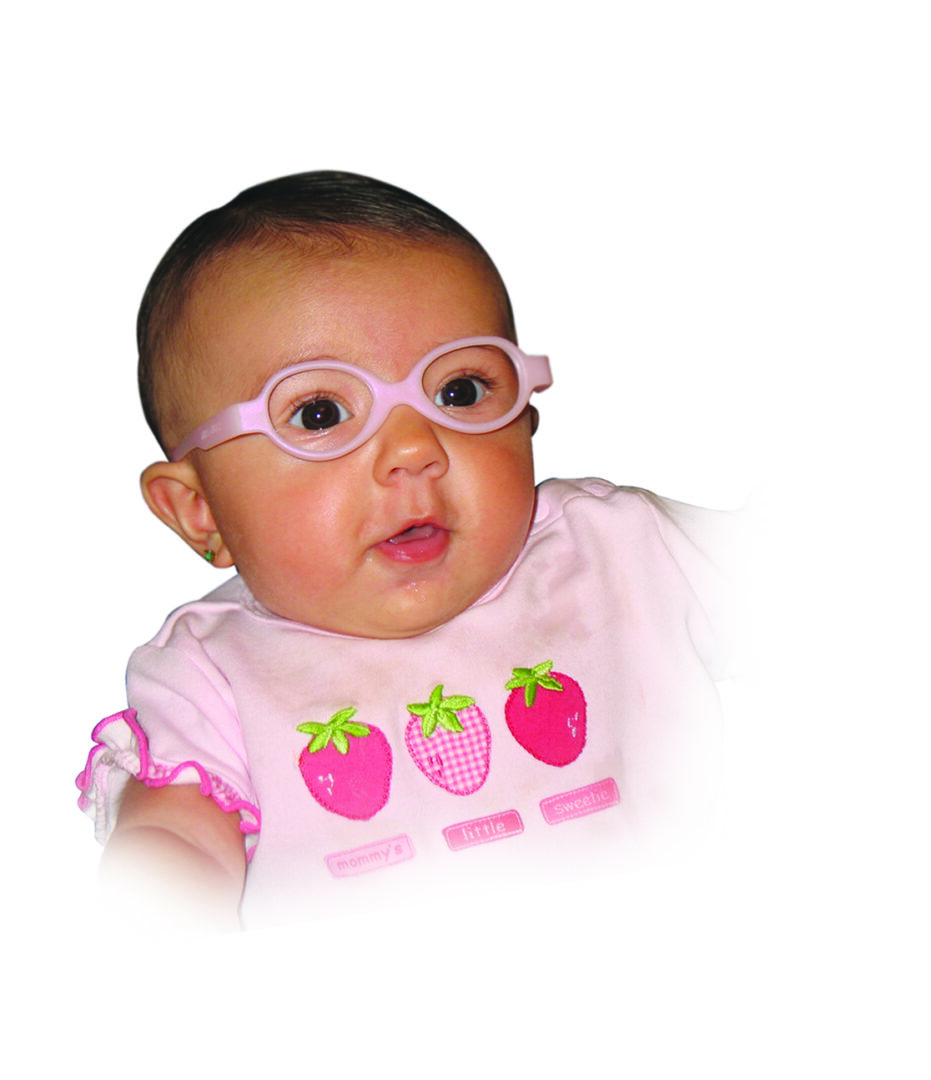 A baby wearing glasses and pink shirt.